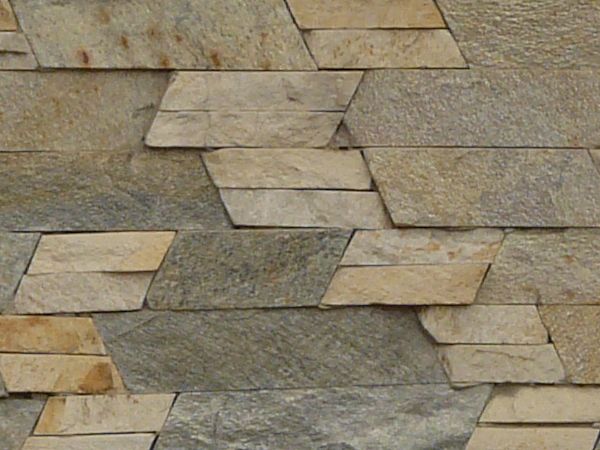 Dark multi-colored stone set linearly in slanted patterns.